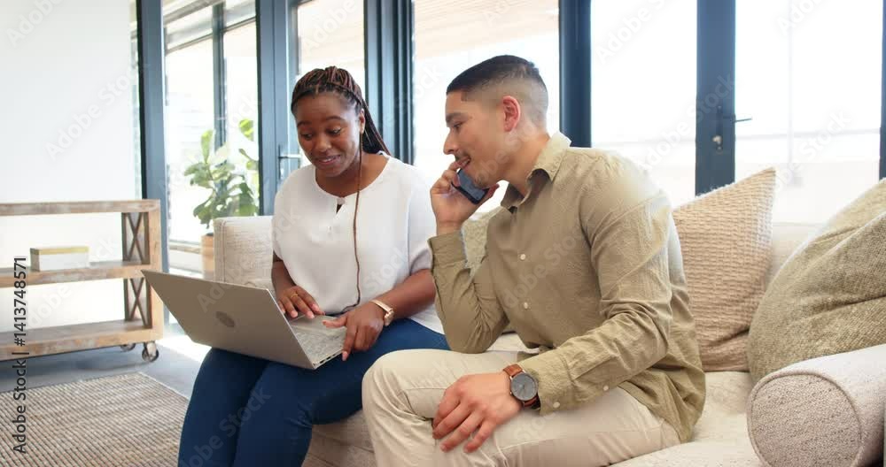 Diverse couple working on laptop and talking on phone in modern living room, enjoying natural light Diverse couple working on laptop and talking on phone in modern living room, enjoying natural light