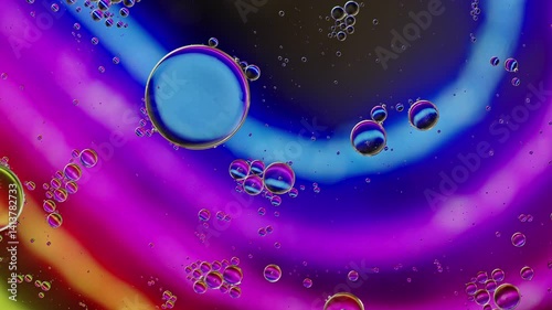 Colorful Oil Bubbles Moving on a Water Surface
