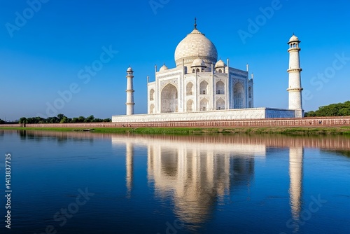 The Taj Mahal reflecting in the still waters of the Yamuna River during sunrise