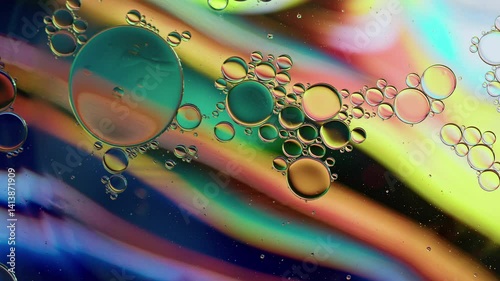 Colorful Oil Bubbles Moving on a Water Surface
