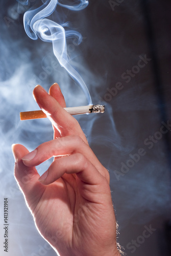 Smoking Cigarette in Hand with Smoke