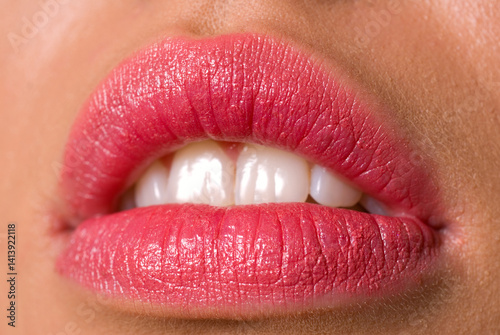 Beautiful Woman's Lips with Pink Lipstick and White Teeth