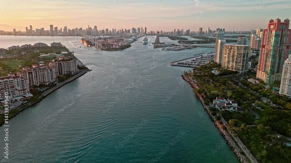 Cruise ship in canal leaving port of Miami. Sea marina aerial. luxury marina and port. Luxury vacation building. Miami aerial view of canal in sunset. Miami sea marina leading to port. Traveling Cruise ship in canal leaving port of Miami. Sea marina aerial. luxury marina and port. Luxury vacation building. Miami aerial view of canal in sunset. Miami sea marina leading to port. Traveling