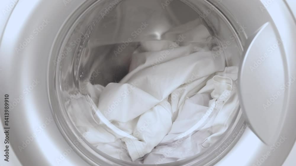 washing machine washes white laundry
