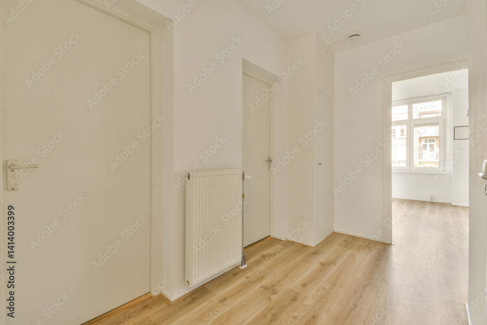 Fototapeta premium an empty room with white walls and wood flooring the door is open on the right side, there is a window in the