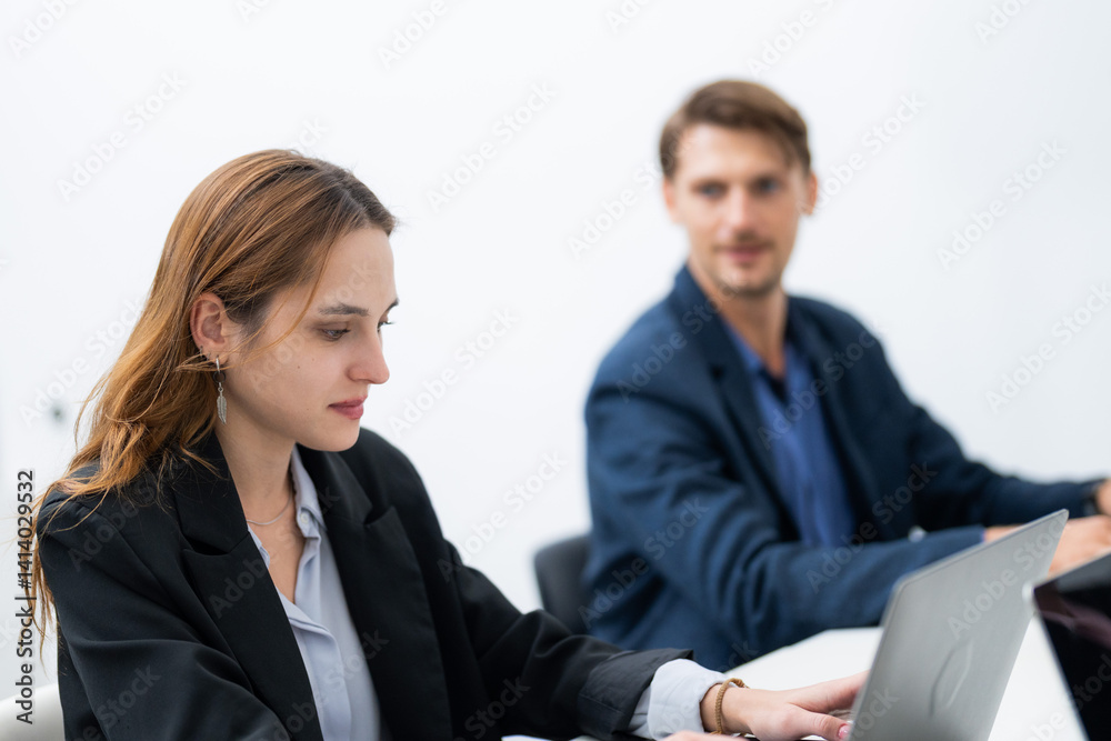 Professional setting with focused collaboration in a modern office during working hours Professional setting with focused collaboration in a modern office during working hours