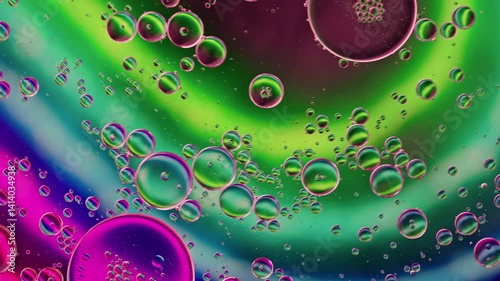Colorful Oil Bubbles Moving on a Water Surface