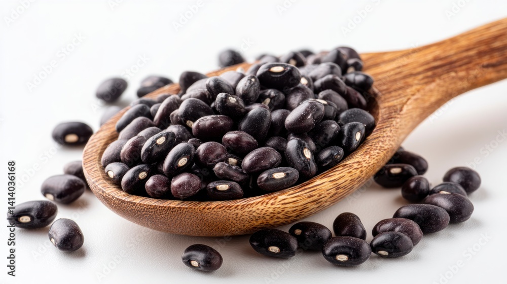 Fototapeta premium Black Beans on Wooden Spoon Isolated on White Background
