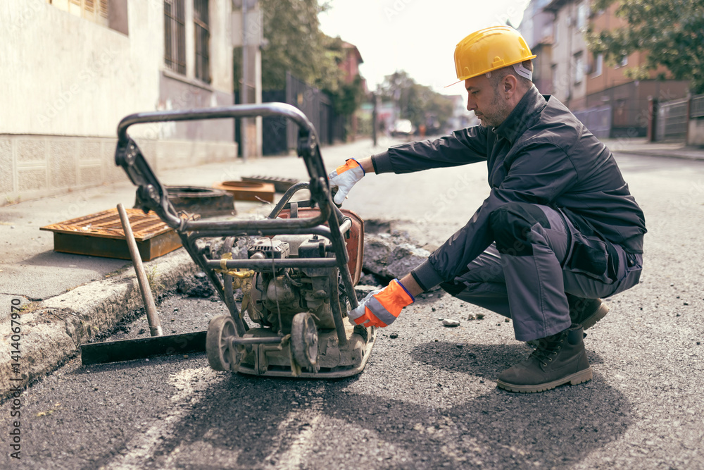 Construction worker working on a public city road reconstruction
