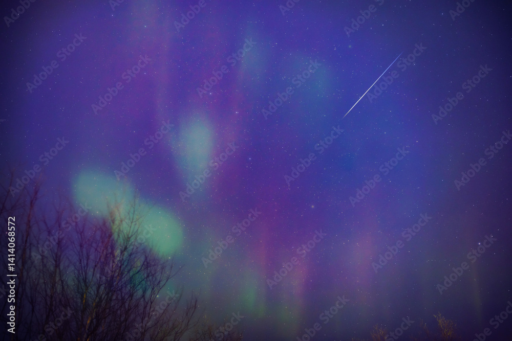 Aurora borealis, polar lights with Milky Way stars.
