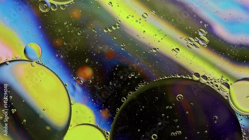 Colorful Oil Bubbles Moving on a Water Surface