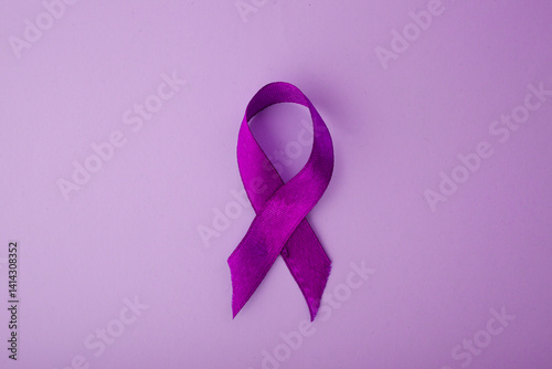 Purple Awareness Ribbon On Purple Background. World Cancer Day.