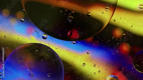 Colorful Oil Bubbles Moving on a Water Surface