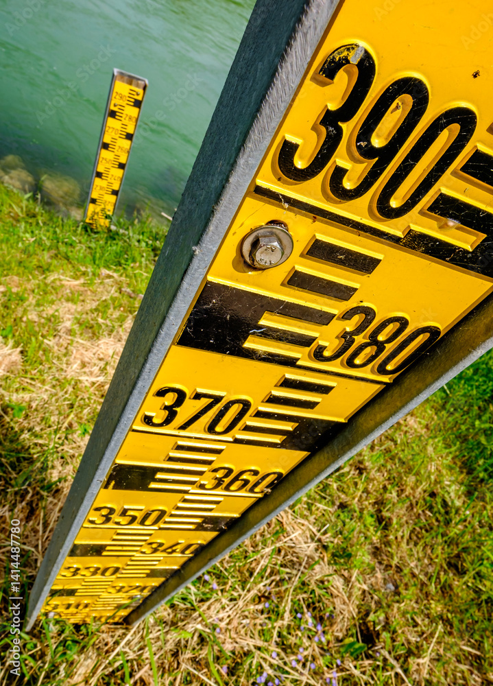 Water level measurement devices positioned along a waterway provide critical data for monitoring flood risks and managing river conditions throughout the year