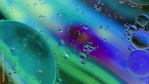 Colorful Oil Bubbles Moving on a Water Surface