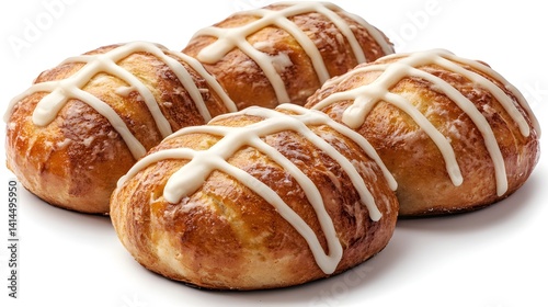 Four golden brown sweet buns topped with a delicious creamy white icing are displayed on a white background.