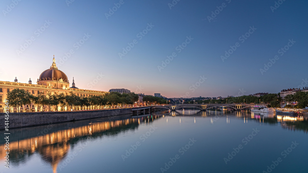 Fototapeta premium The Grand Hotel-Dieu Day to night transition timelapse hyperlapse in Lyon, France.