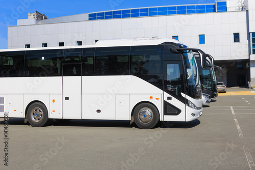 Tour Buses in the parking lot near the building