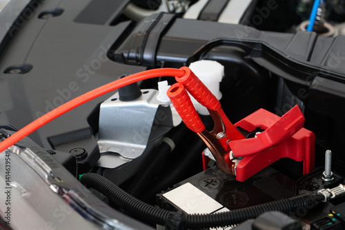 Wallpaper Mural The booster cables positive terminal and negative terminal with charging car battery by car jump cables. the electricity trough. Concept of broken car or error car. safe driving. Torontodigital.ca