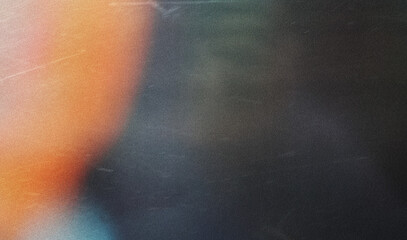 grainy colorful warm orange light leaks on black background with dust texture. abstract damaged scratched retro film analog effect for using over photos as overlay or screen filter