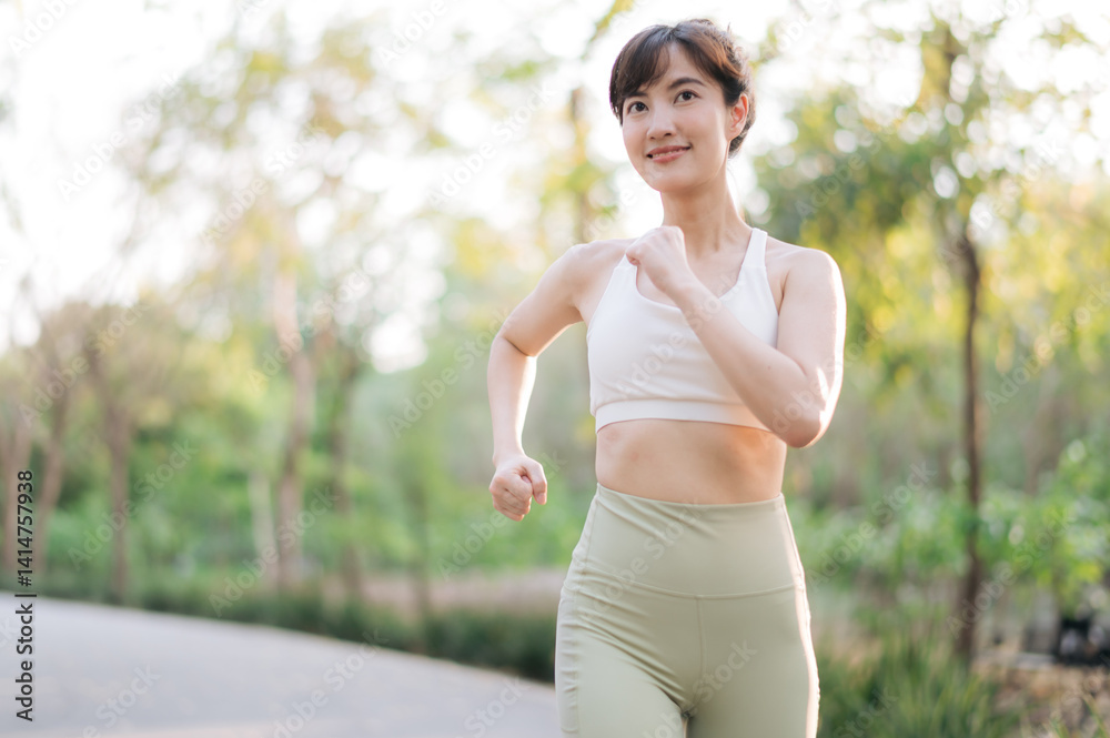 Asian woman jogging outdoors in park, wearing white sports top and green leggings, smiling and enjoying healthy lifestyle in natural setting. Healthy and active lifestyle concept Asian woman jogging outdoors in park, wearing white sports top and green leggings, smiling and enjoying healthy lifestyle in natural setting. Healthy and active lifestyle concept