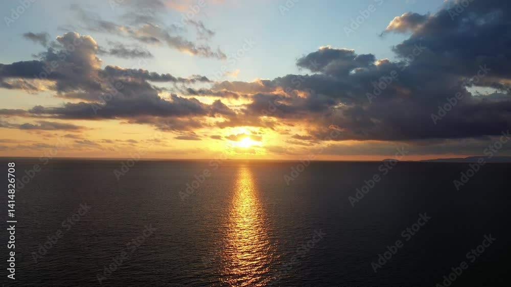 The blazing sunset on the horizon in Europe, Greece, Peloponnese, Mani, towards Gythio, in summer, on a sunny evening. The blazing sunset on the horizon in Europe, Greece, Peloponnese, Mani, towards Gythio, in summer, on a sunny evening.
