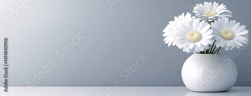 Obraz na płótnie Two white daisies in a clear vase stand out against a bright background, showcasing natural beauty in a minimalistic setting w salonie