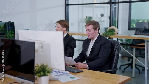 Business professionals collaborate in a modern office space during a project meeting in the afternoon
