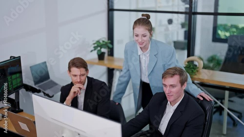 Colleagues collaborating on a project in a modern office environment in the afternoon