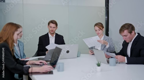 Team collaborates in modern office during strategic meeting to discuss project updates and future goals