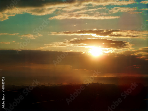 Sunset over river with dramatic sky and clouds for travel themes photo