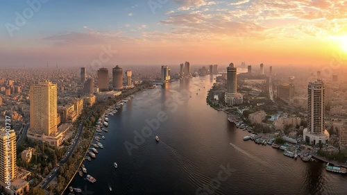 Cairo at Dawn: An aerial panorama of Cairo's skyline at dawn, showcasing the city's architectural diversity along the Nile River, creating a majestic view.