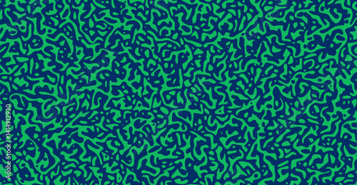 Organic camouflage pattern in green and navy. Abstract pattern featuring green, amoeba-like organic shapes on a deep navy background.