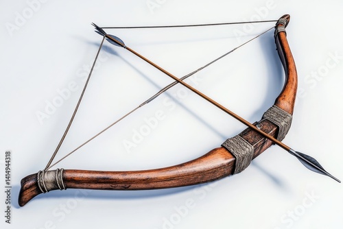 Artisan-crafted wooden bow resting on a white surface with quiver full of arrows nearby