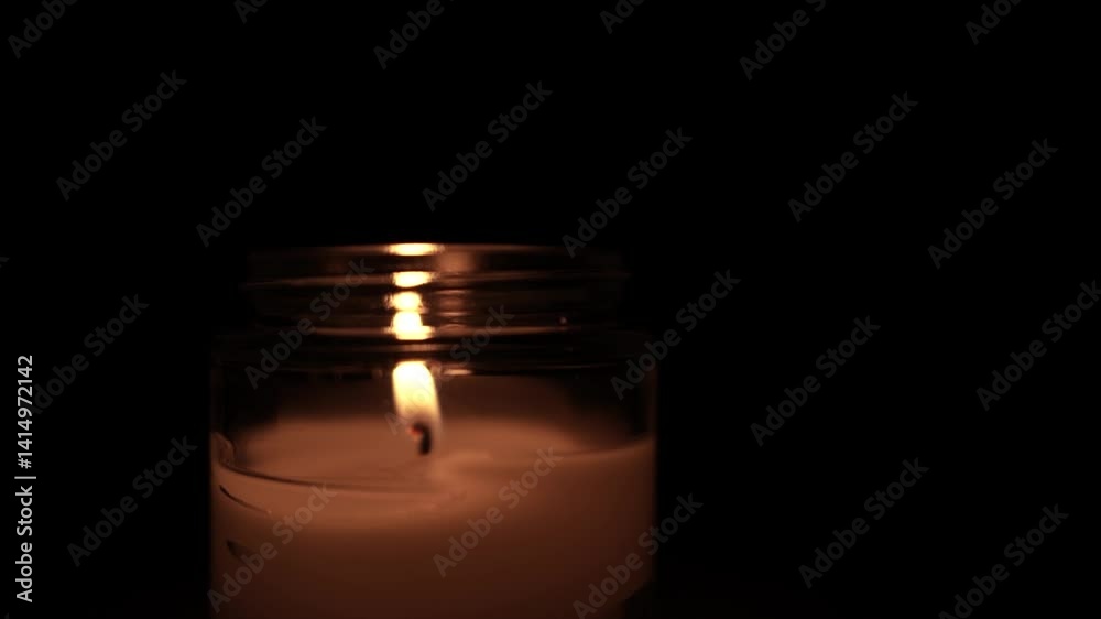 Candle Lit in Darkness with Soft Glow Candle Lit in Darkness with Soft Glow