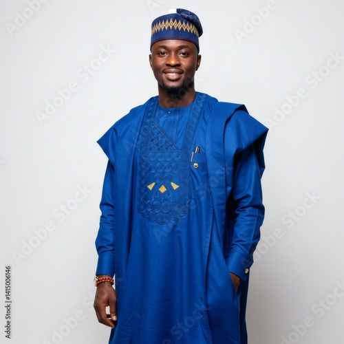 A smiling african man in traditional blue attire, beautifully detailed, in a studio setting on white.