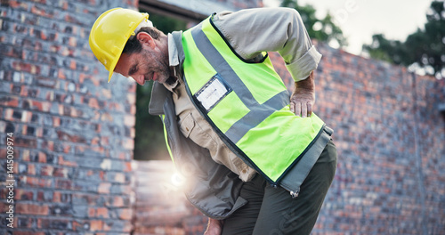 Obraz na płótnie Man, construction worker and back pain with injury, work site accident or spasm with burnout. Stress fracture, contractor with muscle tension or pressure, inflammation or fibromyalgia emergency w salonie