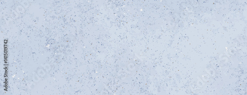 Obraz na płótnie A light blue background with a speckled texture. The background is soft and subtle, with blue and gray speckles adding depth to the background. Minimal grainy speckled texture background vector w salonie