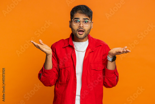 Fotografie Sad young Indian man feeling hopelessness loneliness, nervous breakdown, loses becoming surprised by lottery results, bad fortune, loss unlucky news