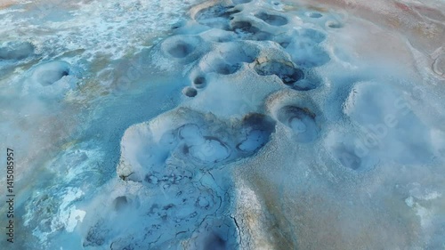 Colorful top-down view of geothermal surface activity in Hverir near Lake Myvatn, showing intense volcanic chemistry in action.
