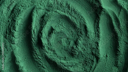 Heap of green spirulina algae powder spins, close up. Green powder super food, macro, rotation. Dietary supplement to improve health. Seaweed superfood concept. Healthy food background