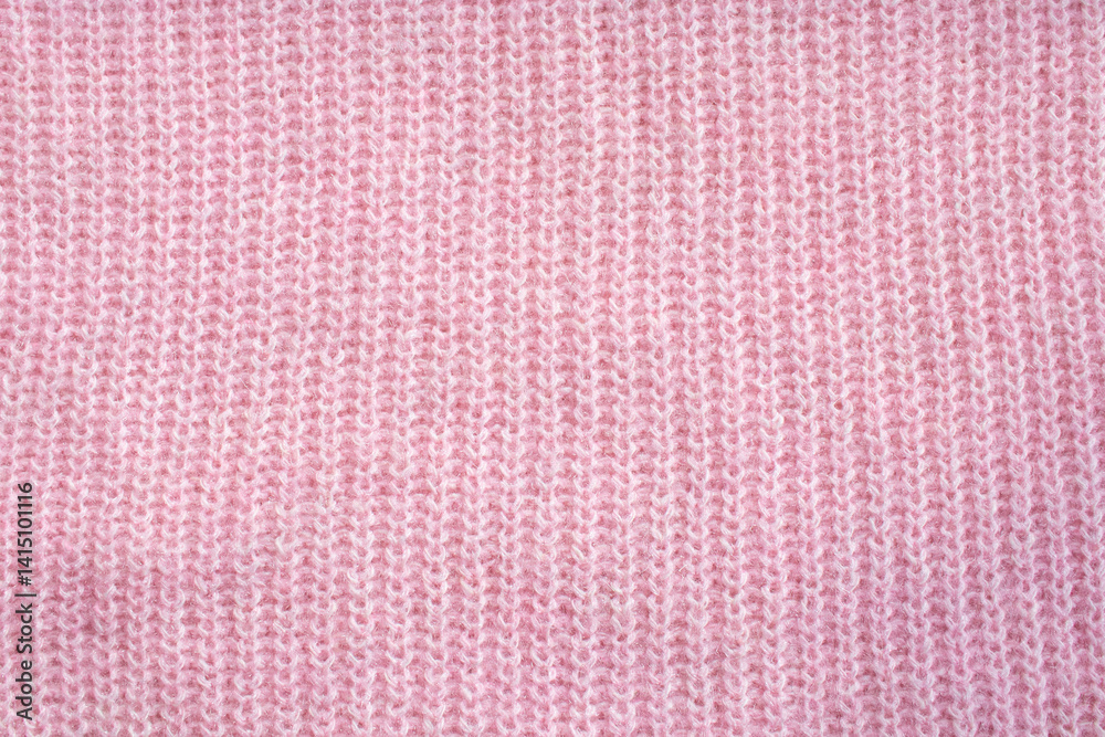 Fototapeta premium Close-up of a soft pink knitted sweater texture