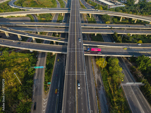 Obraz na płótnie Aerial view city transport junction cross road with vehicle movement w salonie