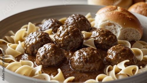 Delicious Meatballs in Brown Sauce with Bread Rolls and Pasta