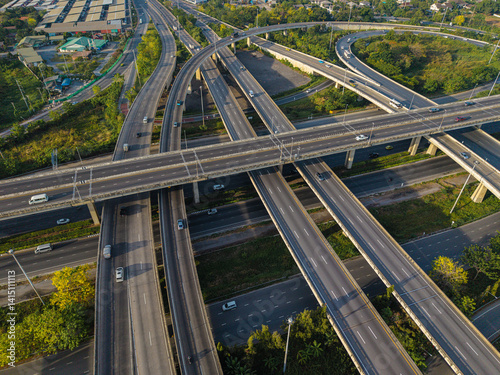Obraz na płótnie Aerial view city transport junction cross road with vehicle movement w salonie