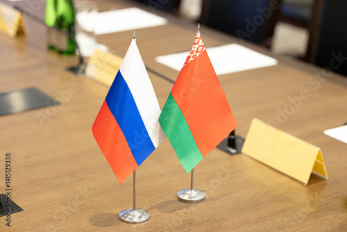 Flags of cooperation between Russia and Belarus. Flags of Russia and Belarus on the negotiating table. Ideal for news.