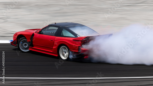 Obraz na płótnie Car drifting on asphalt race track with lots of smoke from burning tires, Professional driver drift car on asphalt race track, Car motion blurred, Motorsport car drift. w salonie
