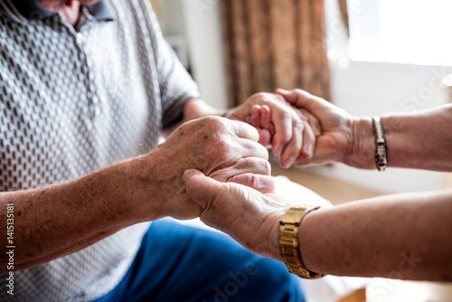 Konstfotografi Close-up of two old people holding hands, showing support and care