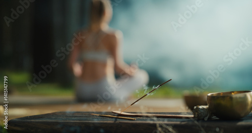 Photography Incense Stick Burns Softly in the Foreground, Releasing Gentle Smoke into the Air