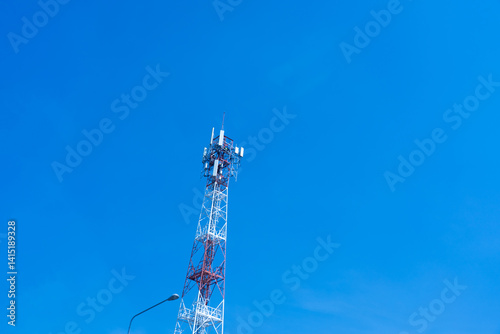 Signal towers against a blue sky in the afternoon